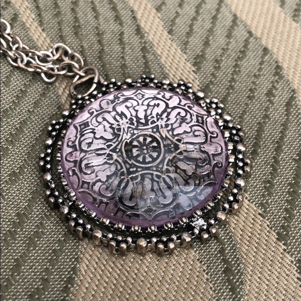 Purple and silver circular medallion necklace.